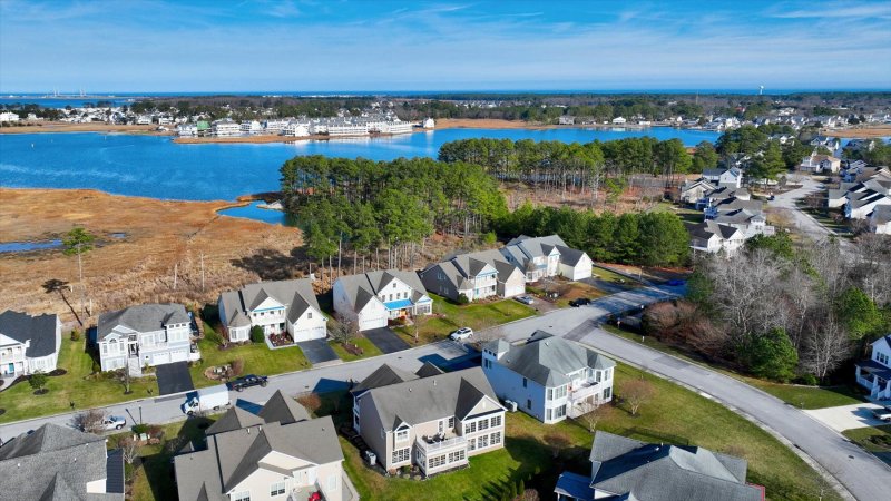 BETHANY BEACH, INVESTMENT OPPORTUNITY, PORCH, PATIO, COASTAL COMMUNITY, DELAWARE HOMES, DELAWARE REAL ESTATE, DELAWARE BEACHES, COMMUNITY AMENITIES, REAL ESTATE, HOUSE HUNTING, OUTDOOR SHOWER, WATERFRONT COMMUNITY, BOAT DOCK